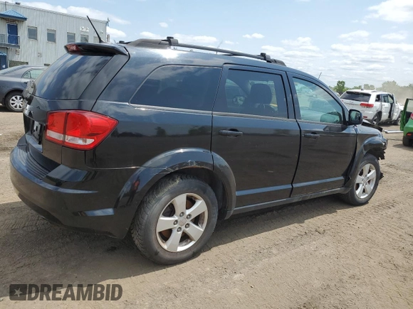 2013 Dodge Journey SE with VIN 3C4PDCAB0DT500365, listed as a Copart auction lot 61033665 with 193,231 mi miles and Salvage title. Bid and sale history available at DreamBid. Image 3.