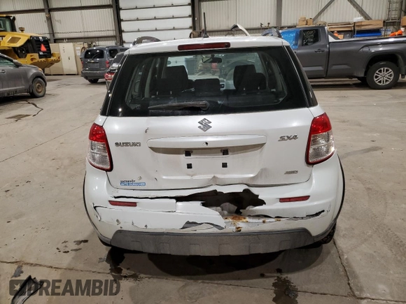 2013 Suzuki SX4 Crossover z VIN JS2YB5A30D6102684, wystawiony jako Copart lot #88725715 z przebiegiem 104 023 mil mil oraz Szkoda całkowita • Salvage title. Historia ofert i sprzedaży dostępna na DreamBid. Obrazek 6.