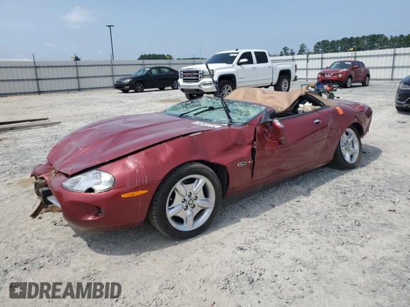 1999 Jaguar XK with VIN SAJGX204XXC038435, listed as a Copart auction lot 64843714 with Not Provided miles and Salvage Title. Bid and sale history available at DreamBid. Image 1.