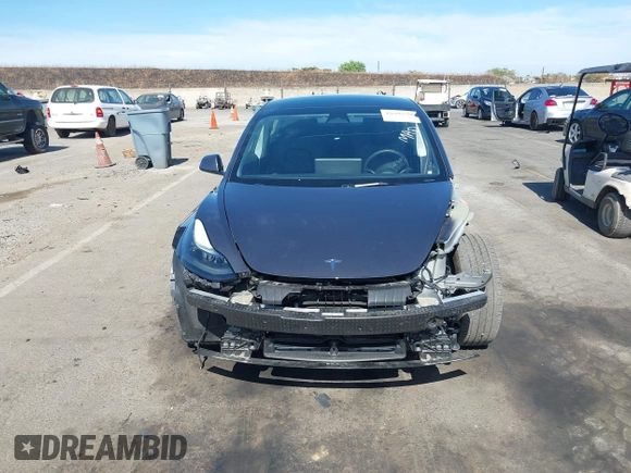 2023 Tesla Model 3 with VIN 5YJ3E1EAXPF652089, listed as a IAAI auction lot 42666520 with 17,679 mi miles and . Bid and sale history available at DreamBid. Image 13.
