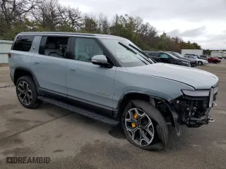 2023 Rivian R1S Adventure with VIN 7PDSGABA4PN011024, listed as a Copart auction lot 72703154 with 14,043 mi miles and Salvage Title. Bid and sale history available at carsss.com. Image 4.
