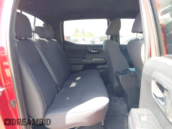 2018 Toyota Tacoma SR5 with VIN 5TFAZ5CN0JX063350, listed as a IAAI auction lot 41829396 with 61,155 mi miles and . Bid and sale history available at DreamBid. Image 8.