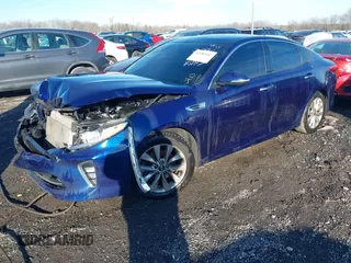 2018 Kia Optima LX with VIN 5XXGT4L3XJG242796, listed as a IAAI auction lot 41181640 with 128,344 mi miles. Bid and sale history available at carsss.com. Image 2.