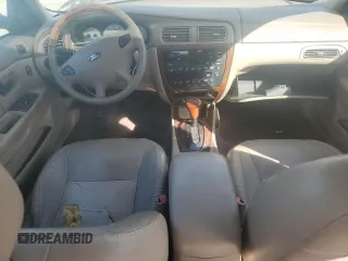 2003 Ford Taurus SEL Deluxe with VIN 1FAFP56S23G221922, listed as a Copart auction lot 79673294 with 142,911 mi miles and Salvage Title. Bid and sale history available at DreamBid. Image 8.