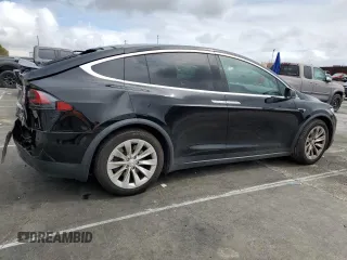 2018 Tesla Model X 75D with VIN 5YJXCBE24JF130216, listed as a Copart auction lot 48894215 with 75,694 mi miles and Salvage Title. Bid and sale history available at carsss.com. Image 3.