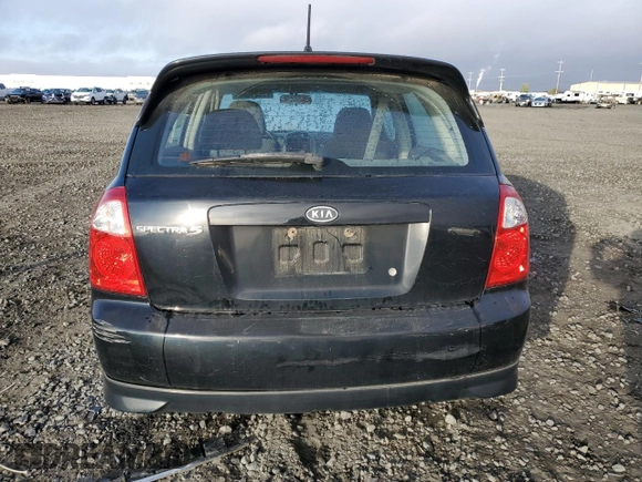 2005 Kia Spectra with VIN KNAFE161655093051, listed as a Copart auction lot 77821904 with 104,874 mi miles and Salvage Title. Bid and sale history available at carsss.com. Image 6.