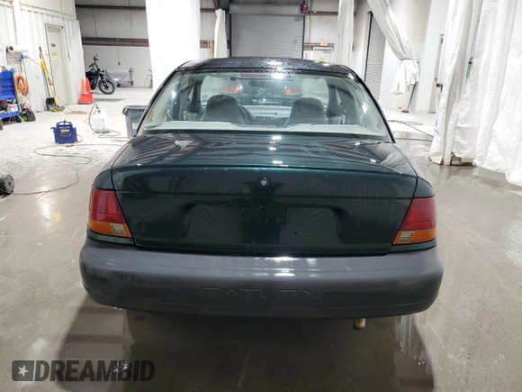1998 Saturn SL z VIN 1G8ZH5280WZ312544, wystawiony jako Copart lot #50971665 z przebiegiem 119 855 mil mil oraz Szkoda całkowita • Salvage title. Historia ofert i sprzedaży dostępna na DreamBid. Obrazek 6.