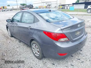 2014 Hyundai Accent GLS with VIN KMHCT4AE6EU670895, listed as a IAAI auction lot 42197066 with 142,983 mi miles and . Bid and sale history available at carsss.com. Image 3.