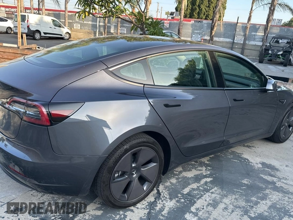 2023 Tesla Model 3 with VIN 5YJ3E1EA1PF607137, listed as a Copart auction lot 62613375 with 27,271 mi miles and Clean title. Bid and sale history available at DreamBid. Image 4.