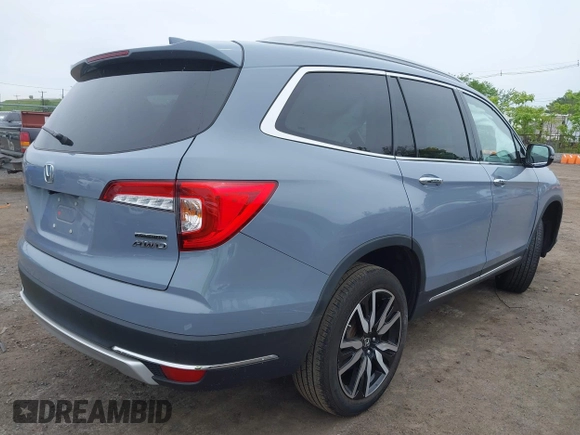 2022 Honda Pilot Touring 7-Passenger with VIN 5FNYF6H68NB056077, listed as a IAAI auction lot 42357338 with 18,193 mi miles and . Bid and sale history available at DreamBid. Image 4.