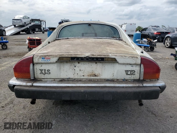 1989 Jaguar XJS z VIN SAJNY584XKC161154, wystawiony jako Copart lot #70912984 z przebiegiem 65 188 mil mil oraz Czysty tytuł • Clean title. Historia ofert i sprzedaży dostępna na DreamBid. Obrazek 6.