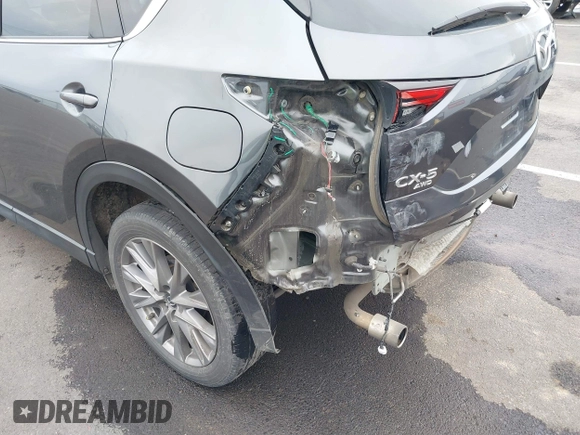 2020 Mazda CX-5 Grand Touring with VIN JM3KFBDM4L0829861, listed as a IAAI auction lot 41826250 with 62,091 mi miles and . Bid and sale history available at carsss.com. Image 6.