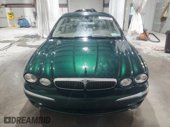 2003 Jaguar X-Type 2.5L Manual z VIN SAJEA51D63XD54591, wystawiony jako Copart lot #57638355 z przebiegiem 93 905 mil mil oraz Szkoda całkowita • Salvage title. Historia ofert i sprzedaży dostępna na DreamBid. Obrazek 5.
