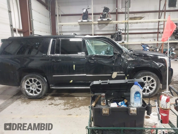 2015 GMC Yukon XL SLT with VIN 1GKS2HKC9FR175011, listed as a IAAI auction lot 41510519 with 194,136 mi miles. Bid and sale history available at carsss.com. Image 13.