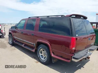 1999 Chevrolet Suburban with VIN 1GBFK16R5XJ335005, listed as a IAAI auction lot 42542755 with 200,599 mi miles and . Bid and sale history available at DreamBid. Image 3.