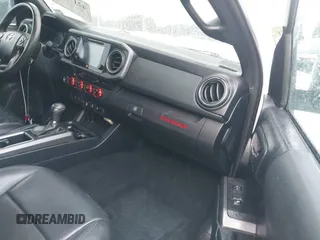 2019 Toyota Tacoma SR z VIN 3TMCZ5AN0KM232852, wystawiony jako IAAI lot #42178269 z przebiegiem 71 545 mil mil oraz . Historia ofert i sprzedaży dostępna na DreamBid. Obrazek 5.