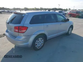 2014 Dodge Journey SE with VIN 3C4PDCAB0ET221998, listed as a IAAI auction lot 40609907 with 203,241 mi miles and . Bid and sale history available at carsss.com. Image 4.