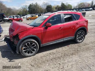 2016 Mazda CX-5 Grand Touring with VIN JM3KE2DY5G0692554, listed as a Copart auction lot 51322475 with 128,086 mi miles and Salvage Title. Bid and sale history available at carsss.com. Image 1.