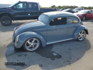 1965 Volkswagen Beetle with VIN 115467066, listed as a Copart auction lot 74195744 with Not Provided miles and Salvage Title. Bid and sale history available at DreamBid. Image 1.