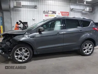 2016 Ford Escape Titanium with VIN 1FMCU9J90GUB35593, listed as a IAAI auction lot 42309020 with 173,019 mi miles and . Bid and sale history available at DreamBid. Image 14.