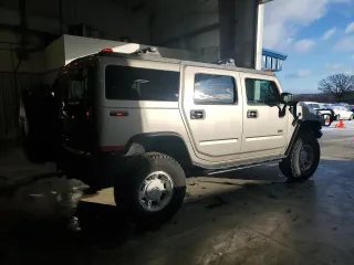 2003 Hummer H2 with VIN 5GRGN23U53H101713, listed as a Copart auction lot 85216034 with 189,549 mi miles and Non Repairable. Bid and sale history available at carsss.com. Image 3.