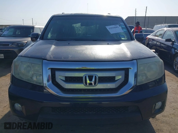 2011 Honda Pilot Touring with VIN 5FNYF4H92BB090056, listed as a IAAI auction lot 42010682 with 201,640 mi miles. Bid and sale history available at carsss.com. Image 12.