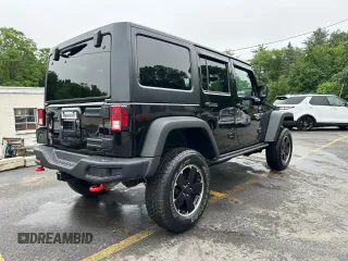 2015 Jeep Wrangler Unlimited Rubicon z VIN 1C4BJWFG2FL541572, wystawiony jako Copart lot #61723875 z przebiegiem 163 169 mil mil oraz Czysty tytuł • Clean title. Historia ofert i sprzedaży dostępna na DreamBid. Obrazek 3.