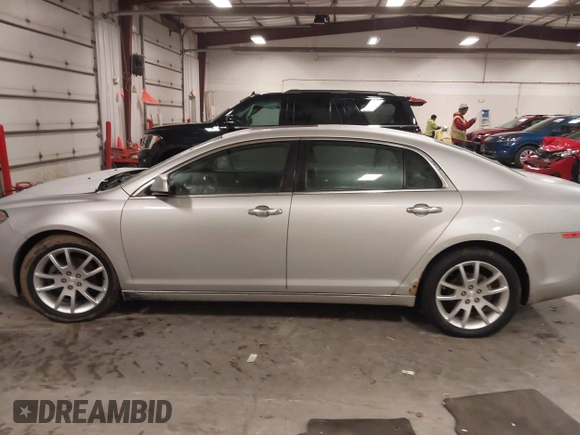 2012 Chevrolet Malibu LTZ with VIN 1G1ZG5E77CF375464, listed as a IAAI auction lot 41509140 with 197,329 mi miles and . Bid and sale history available at DreamBid. Image 14.