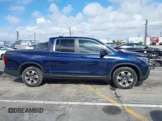 2017 Honda Ridgeline RTL-T with VIN 5FPYK2F68HB001759, listed as a IAAI auction lot 41562343 with 59,633 mi miles and . Bid and sale history available at DreamBid. Image 13.