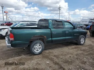 2001 Dodge Dakota z VIN 1B7HG2AX81S320355, wystawiony jako Copart lot #55410715 z przebiegiem 164 931 mil mil oraz Szkoda całkowita • Salvage title. Historia ofert i sprzedaży dostępna na DreamBid. Obrazek 3.