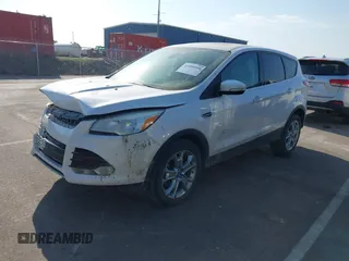 2013 Ford Escape SEL with VIN 1FMCU9H97DUD25280, listed as a IAAI auction lot 41880958 with 132,003 mi miles and . Bid and sale history available at DreamBid. Image 2.