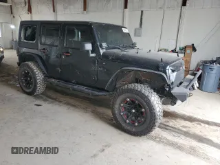 2012 Jeep Wrangler Unlimited Sahara with VIN 1C4BJWEG3CL195271, listed as a Copart auction lot 59947235 with 212,819 mi miles and Salvage title. Bid and sale history available at DreamBid. Image 4.