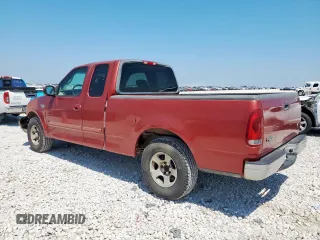 2002 Ford F-150 XL with VIN 1FTRX17202NA40522, listed as a Copart auction lot 58208915 with 100,297 mi miles and Salvage title. Bid and sale history available at DreamBid. Image 2.