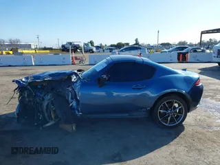 2020 Mazda MX-5 Miata Grand Touring z VIN JM1NDAM75L0412507, wystawiony jako IAAI lot #41573544 z przebiegiem Nie podano mil oraz . Historia ofert i sprzedaży dostępna na DreamBid. Obrazek 14.