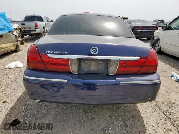 2004 Mercury Grand Marquis GS z VIN 2MEFM74W64X603871, wystawiony jako Copart lot #56545655 z przebiegiem 206 427 mil mil oraz Szkoda całkowita • Salvage title. Historia ofert i sprzedaży dostępna na DreamBid. Obrazek 6.