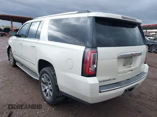 2015 GMC Yukon XL Denali with VIN 1GKS2JKJ2FR590502, listed as a IAAI auction lot 41758575 with 129,777 mi miles. Bid and sale history available at carsss.com. Image 3.