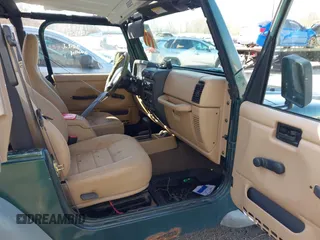 2001 Jeep Wrangler Sport with VIN 1J4FA49S31P317597, listed as a IAAI auction lot 41839524 with 145,164 mi miles. Bid and sale history available at carsss.com. Image 5.