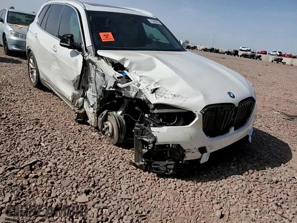 2023 BMW X5 xDrive45e z VIN 5UXTA6C02P9N98430, wystawiony jako Copart lot #51509085 z przebiegiem 24 093 mil mil oraz Szkoda całkowita • Salvage title. Historia ofert i sprzedaży dostępna na DreamBid. Obrazek 12.