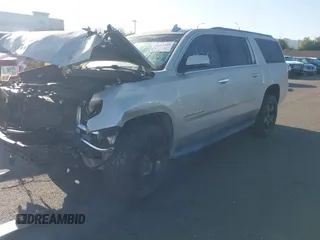 2015 Chevrolet Suburban LT z VIN 1GNSCJKC1FR608117, wystawiony jako IAAI lot #41641560 z przebiegiem 163 770 mil mil oraz . Historia ofert i sprzedaży dostępna na DreamBid. Obrazek 2.