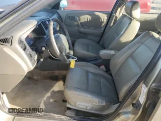 2002 Infiniti G20 Luxury z VIN JNKCP11AX2T509549, wystawiony jako Copart lot #74531114 z przebiegiem 158 364 mil mil oraz Szkody całkowita. Historia ofert i sprzedaży dostępna na DreamBid. Obrazek 7.