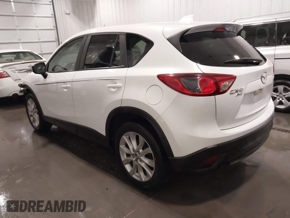 2015 Mazda CX-5 Grand Touring with VIN JM3KE4DY4F0495627, listed as a IAAI auction lot 41887773 with 130,421 mi miles. Bid and sale history available at carsss.com. Image 3.