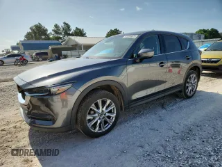 2020 Mazda CX-5 Grand Touring with VIN JM3KFADM2L0803589, listed as a Copart auction lot 61916825 with 63,663 mi miles and Salvage title. Bid and sale history available at DreamBid. Image 1.
