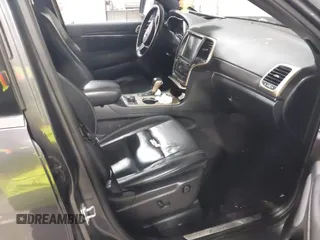 2016 Jeep Grand Cherokee Limited 75th Anniversary with VIN 1C4RJFBG3GC311089, listed as a IAAI auction lot 41953517 with 127,720 mi miles and . Bid and sale history available at DreamBid. Image 5.