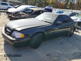 1995 Mercedes-Benz SL with VIN WDBFA76E4SF110048, listed as a Copart auction lot 77410594 with 112,162 mi miles and Clean title. Bid and sale history available at DreamBid. Image 1.