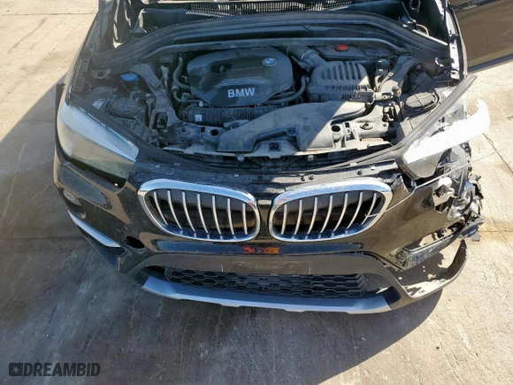 2018 BMW X1 sDrive28i with VIN WBXHU7C31J5H39068, listed as a Copart auction lot 49018985 with 100,611 mi miles and Salvage Title. Bid and sale history available at carsss.com. Image 14.