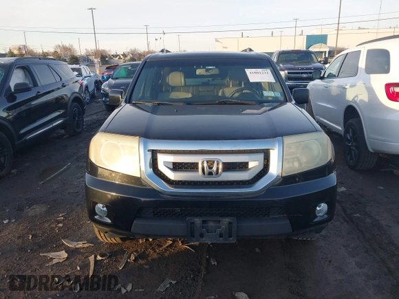 2009 Honda Pilot EX-L with VIN 5FNYF48659B012032, listed as a IAAI auction lot 41801232 with 205,636 mi miles and . Bid and sale history available at carsss.com. Image 12.