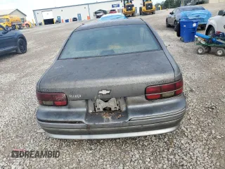 1992 Chevrolet Caprice z VIN 1G1BN53E5NW120694, wystawiony jako Copart lot #73438584 z przebiegiem 156 839 mil mil oraz Czysty tytuł • Clean title. Historia ofert i sprzedaży dostępna na DreamBid. Obrazek 6.