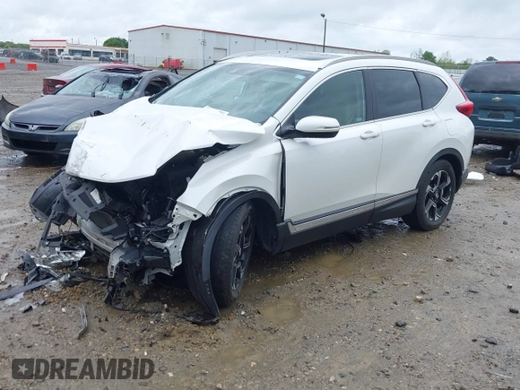 2018 Honda CR-V Touring z VIN 5J6RW1H96JL014087, wystawiony jako IAAI lot #41931640 z przebiegiem Nie podano mil oraz . Historia ofert i sprzedaży dostępna na DreamBid. Obrazek 19.