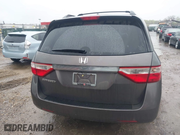 2012 Honda Odyssey EX-L with VIN 5FNRL5H6XCB057557, listed as a IAAI auction lot 42022410 with 174,286 mi miles and . Bid and sale history available at DreamBid. Image 16.