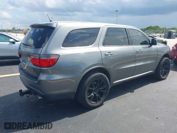 2013 Dodge Durango SXT with VIN 1C4RDHAGXDC500144, listed as a IAAI auction lot 42693122 with 194,519 mi miles and . Bid and sale history available at DreamBid. Image 4.
